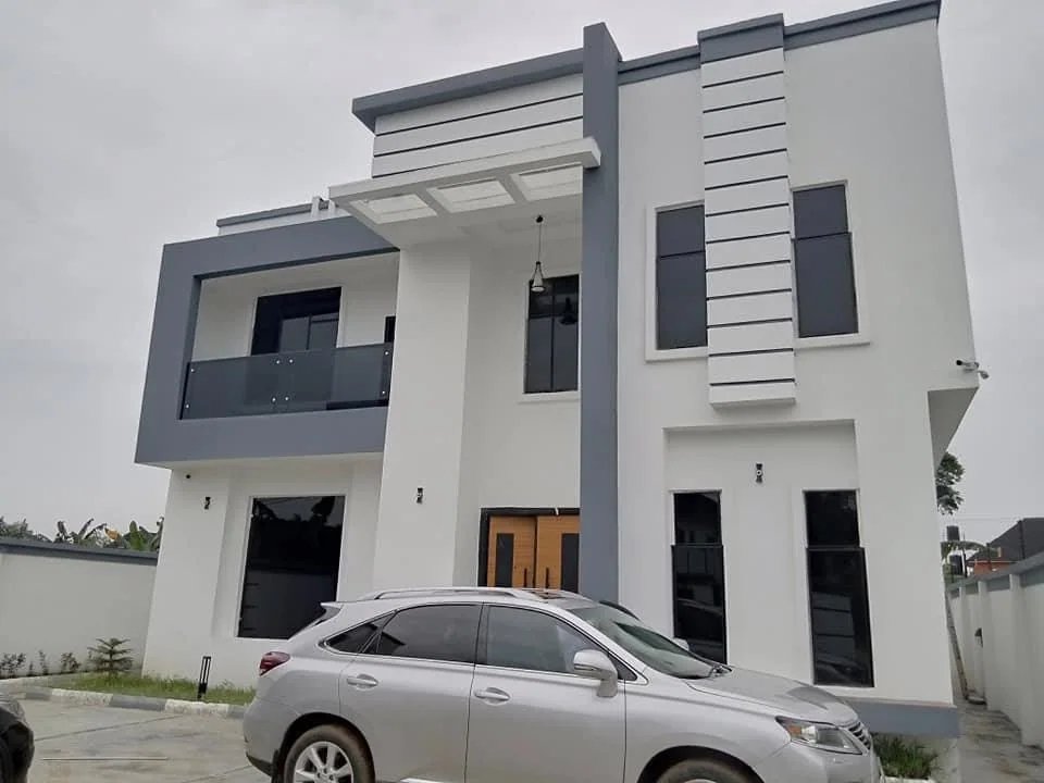 Completed modern white and slate-grey residence, photographed on site