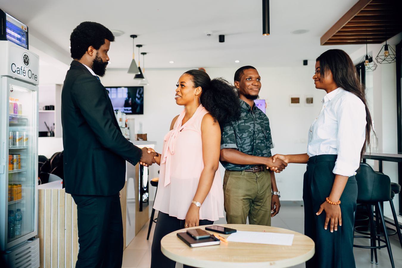 Professionals greeting one another at a meeting in Lagos