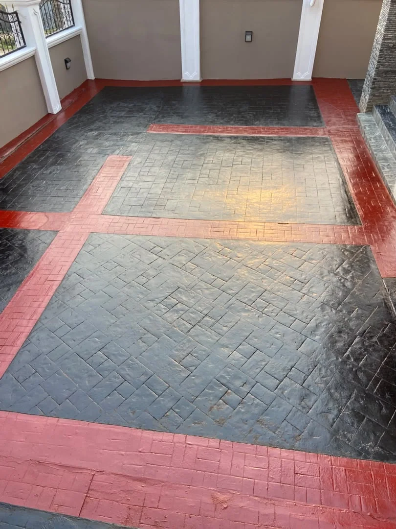 Red and black patterned paved courtyard