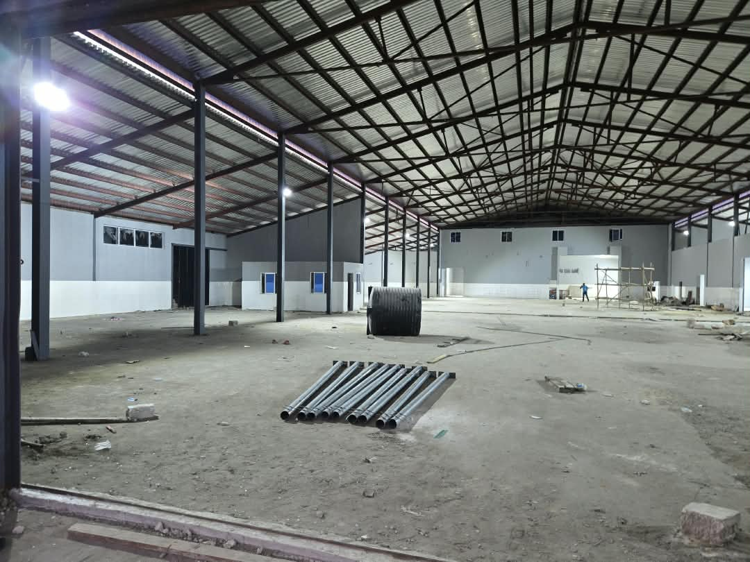 Large factory interior undergoing renovation in Nigeria