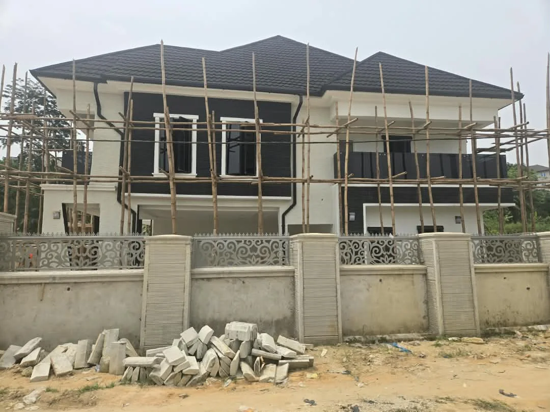 Residence facade under finishing work and scaffolding