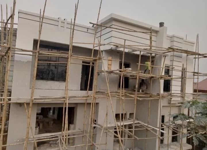 Facade construction and plastering with scaffolding still in place