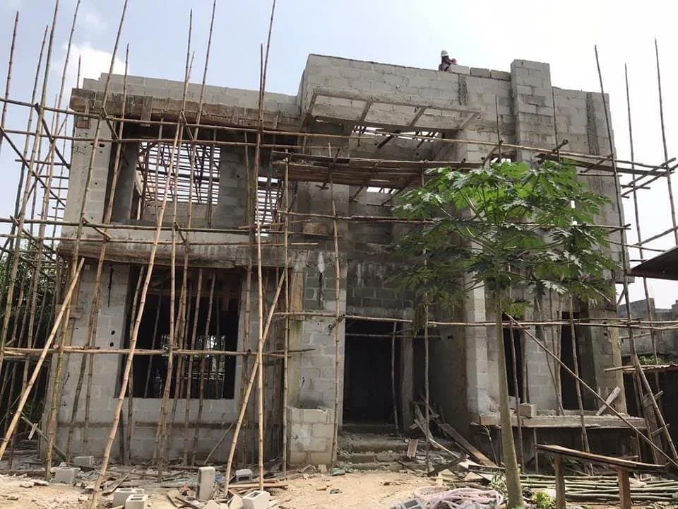 Residence under construction with blockwork and bamboo scaffolding